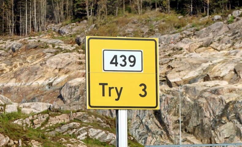 a yellow sign that says try 3 on it