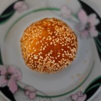 yellow and white round cake on white ceramic plate